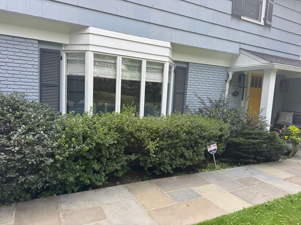 Front bay window and brick facade before renovation, Claflin project
