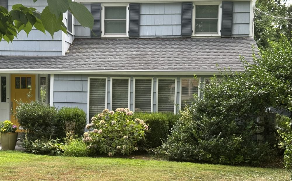 Front entrance with yellow door before renovation, closer view, Claflin project